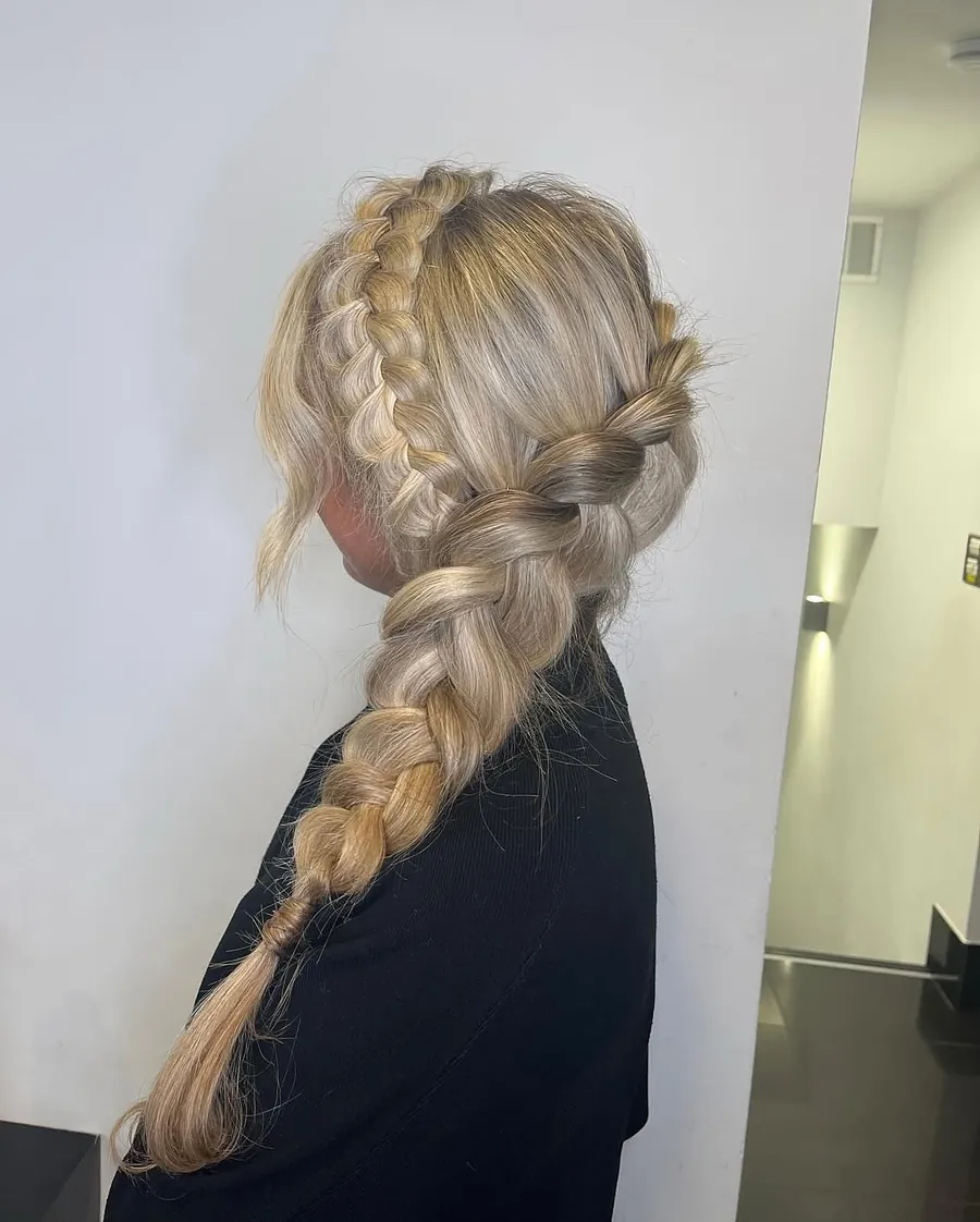 A loose blonde Dutch braid